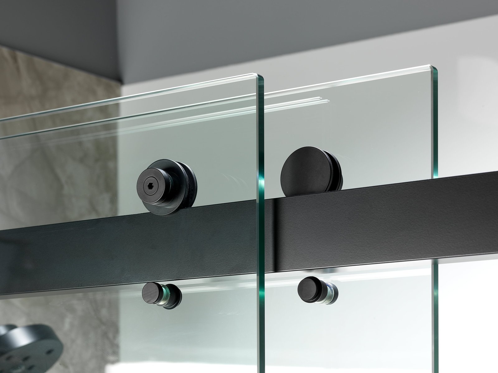 Frameless glass shower with stone-look surround